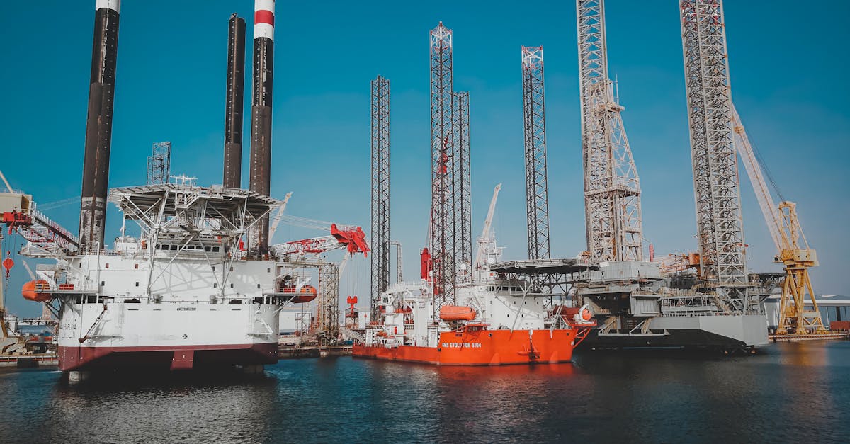 High angle view of offshore oil platforms in Ras Laffan, Qatar under clear blue sky.